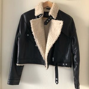 Gently worn; it’s in good condition. Genuine sheep leather